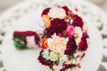 Beautiful wedding bouquet with different flowers, roses