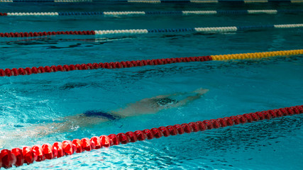 Swimming underwater at sporting events in the pool