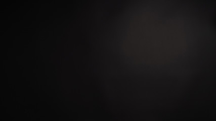 Black background or dark background backdrop in studio shooting.