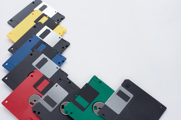 Lot of multi-coloured flexible disks isolated on a white background.