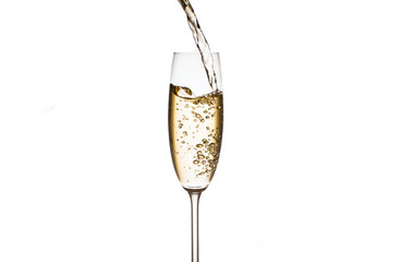 Champagne is poured into glasses on a white background