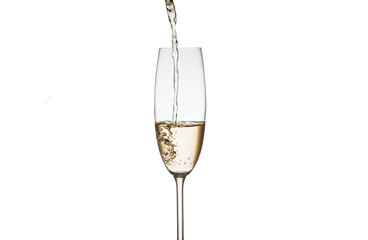 Champagne is poured into glasses on a white background