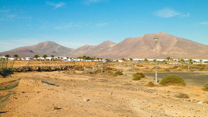 Landscape of desert and suburbs of Playa Blanca, Lanzarote, Canary Islands.