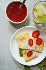Homemade sweet Crepes with ricotta filling / Thin pancakes with cheese stuffing