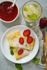 Homemade sweet Crepes with ricotta filling / Thin pancakes with cheese stuffing