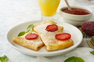 Homemade sweet Crepes with ricotta filling / Thin pancakes with cheese stuffing