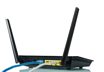 Black router with an attached blue and grey wires isolated on white