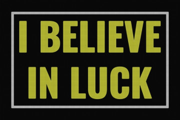 Fototapeta premium I Believe In Luck text on dark screen