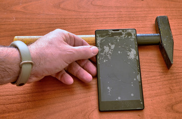 A smartphone with a broken screen and a thousand crack