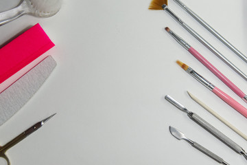 Accessories and supplies for manicure close-up on a white background