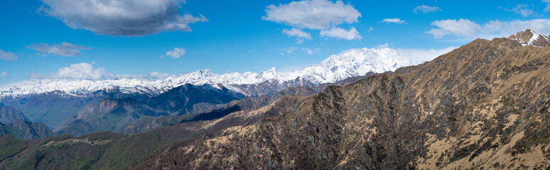 Mountain range, alpine landscape in spring. Monte Rosa massif and nearby mountains seen from Valsesia (Piedmont, Italy)