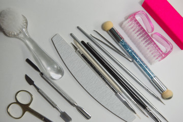 Accessories and supplies for manicure close-up on a white background