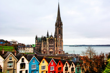 Fototapeta premium Aerial view at houses and Cathedral in Cobh, Ireland. Famous city
