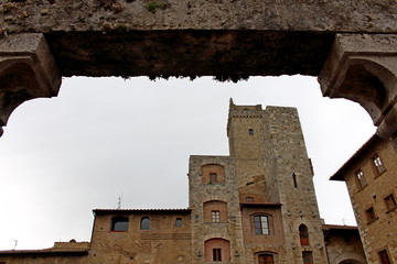 the towers of San Gimignano seen from the well in the center of Piazza della Cisterna
