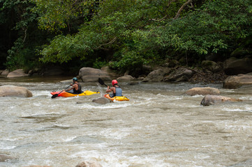 Group of people white water rafting on the rapids of maetaman Mae Taeng river in Chiang Mai...