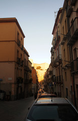 Fototapeta premium Southern sunny city at sunset. Old European Italian architecture.