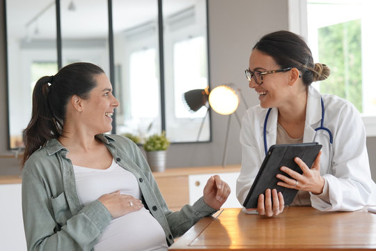 Pregnant Woman At Doctor's Office