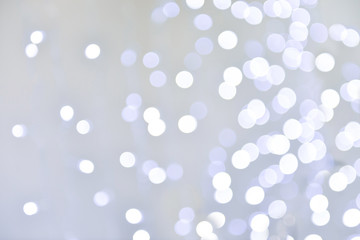 bokeh from christmas white blue lamp light background on gray background