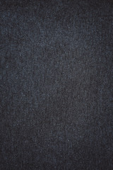 Fototapeta na wymiar dark grey background. abstract texture of fleecy knitted fabric.