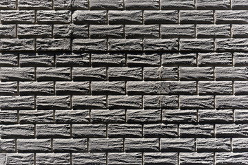 Charcoal black brick texture pattern.