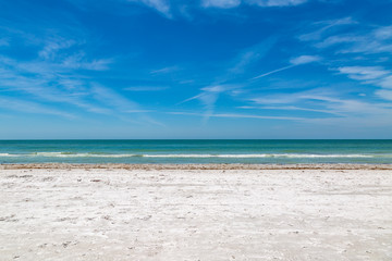A sandy beach on the Florida Gulf Coast, on a sunny day