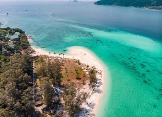 Karma white beach in emerald tropical sea at lipe island