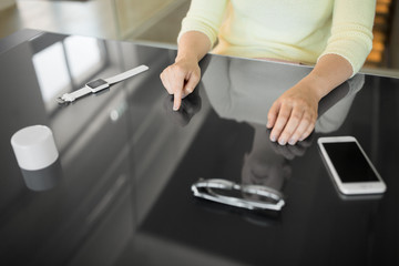 technology and people concept - close up of woman using black interactive panel