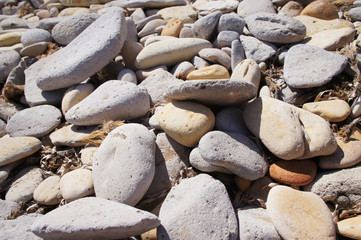 Sea white round stones close up.