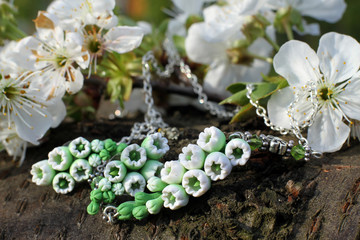 Hand made ear rings and beads in a shape of flowers from polymer clay