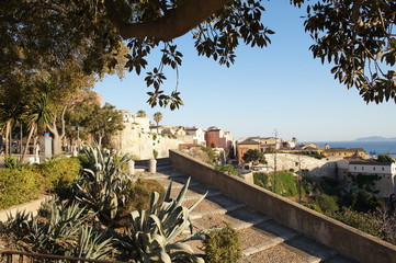Cityscape view from above on the old medieval European Italian city with red roofs in the summer in...