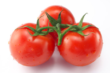 Three red ripe tomatoes