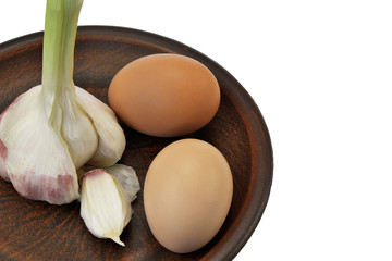 Two eggs and a head of garlic