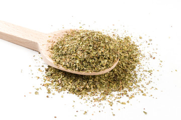 marjoram on wooden spoon on white background