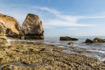Fototapeta na wymiar Rock formations at low tide, at Freshwater Bay on the Isle of Wight