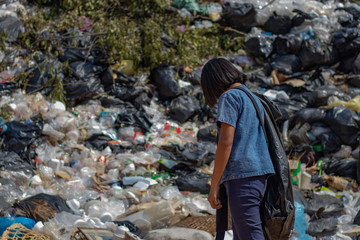 Children find junk for sale and recycle them in landfills, the lives and lifestyles of the poor, Child labor, Poverty and Environment Concepts