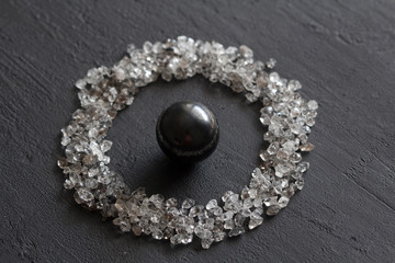 Scattered diamonds on a black background. Raw diamonds and mining, a scattering of natural diamond...