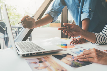 Web designer brainstorming for a strategy plan. Colorful sticky notes with things to do on office board. User experience (UX) concept
