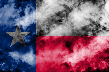 The national flag of the US state Texas in against a gray smoke on the day of independence in different colors of blue red and yellow. Political and religious disputes, customs and delivery.