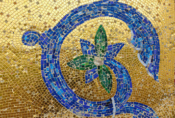 Mosaic fragment. Floral ornament blue on a golden background.