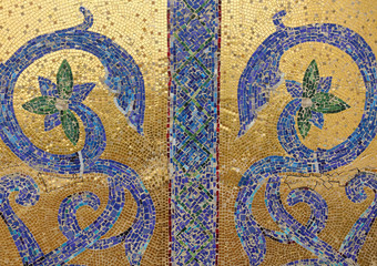 Mosaic fragment. Floral ornament blue on a golden background.