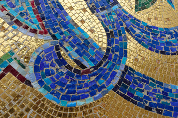 Mosaic fragment. Floral ornament blue on a golden background.