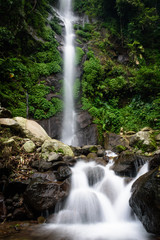 Fototapeta premium Beautiful scene of Semirang Waterfall with lovely smooth water. A Waterfall which is a tourist destination in the city of Ungaran, Semarang, Indonesia.