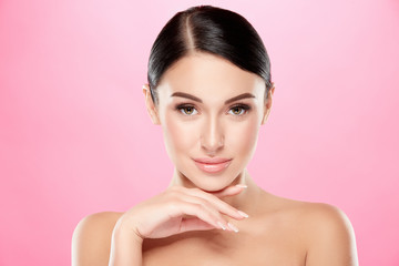 Fototapeta premium Darkhaired girl with nude make up at studio