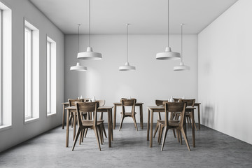 Interior of white pub with industrial lamps