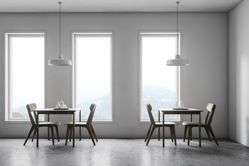 Interior of white cafe with mountain view