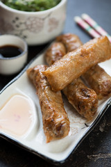 Closeup of vietnamese fried spring rolls or nems, selective focus, vertical shot