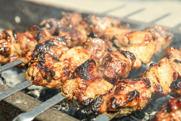 Meat skewers on grill as background, closeup. Outdoor kitchen
