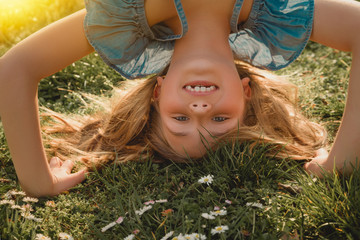 happy child on green gras meadow