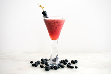 Fototapeta na wymiar Very Berry Bellini Cocktail Garnished with Blueberries