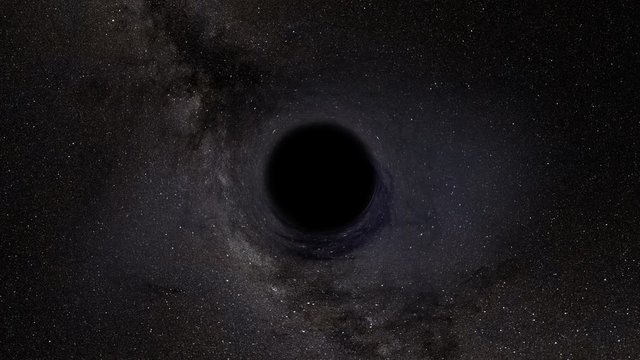 The light of background stars is distorted as a black hole passes in front of them.